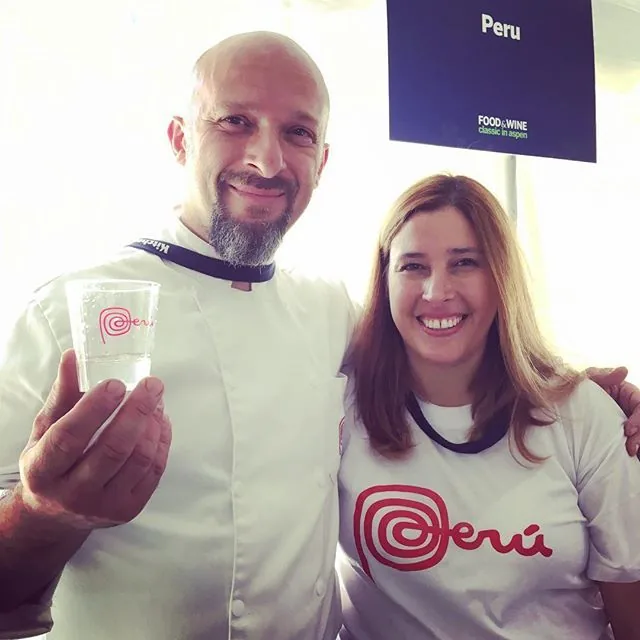 Chef Nicola and Jackeline smiling at the Food & Wine Classic in Aspen, Jackeline in a Perú shirt
