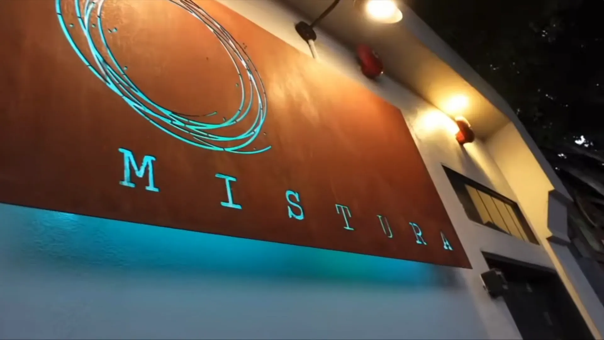 The illuminated Mistura sign outside the restaurant